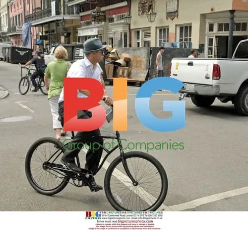 Brad Pitt cycles in New Orleans' French Quarter