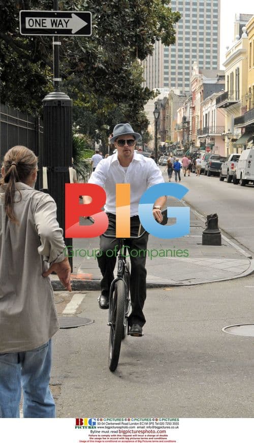 Brad Pitt cycles in New Orleans' French Quarter