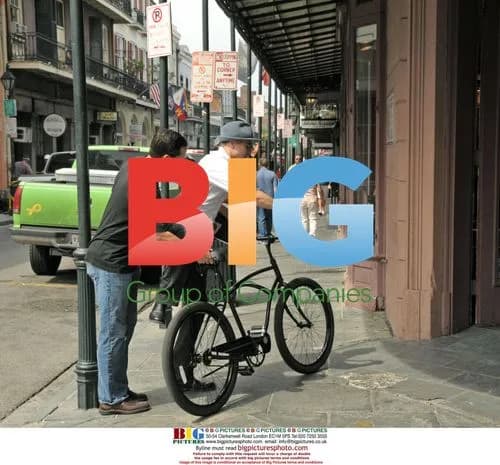Brad Pitt cycles through New Orleans' French Quarter