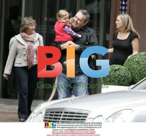 Mark Moraghan leaving hotel with family