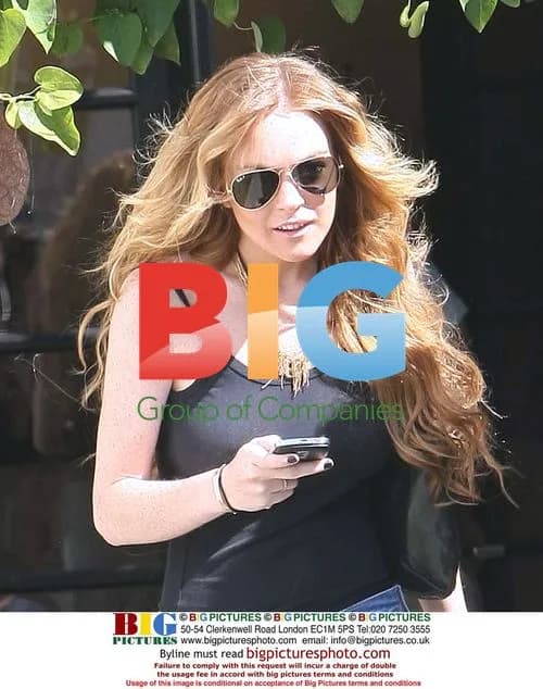 Lindsay Lohan out shopping with 70's hair