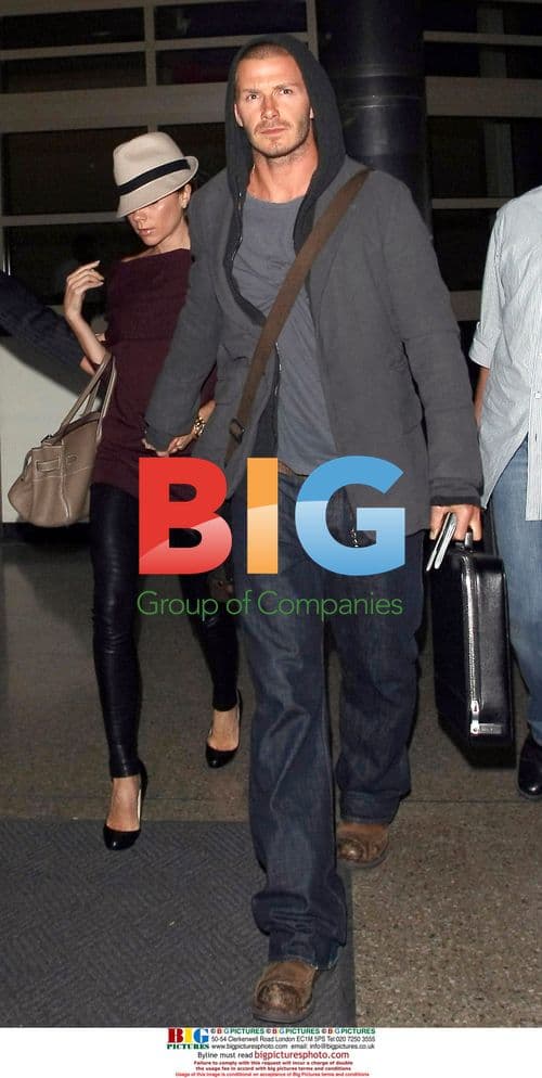 David and Victoria Beckham arrive at LAX