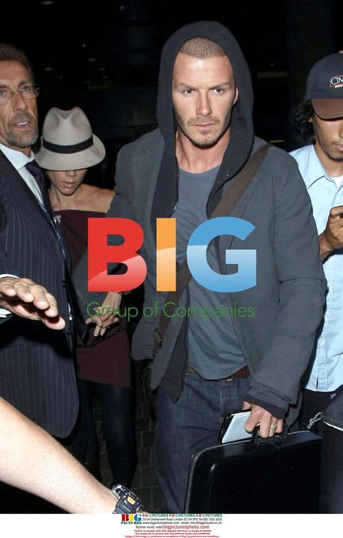 David and Victoria Beckham arrive at LAX