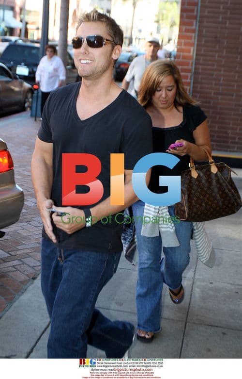 Lance Bass leaves medical building with assistant