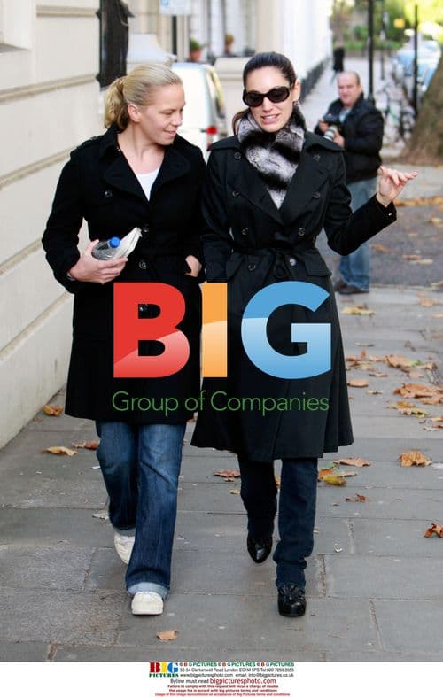 Kelly Brook walks with friend in London