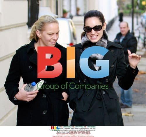 Kelly Brook Walks with Friend in London