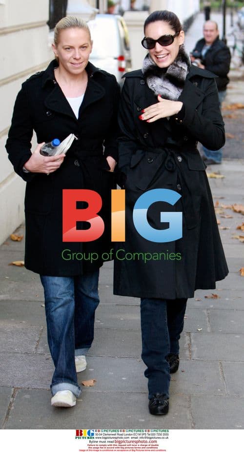 Kelly Brook walks with friend in London