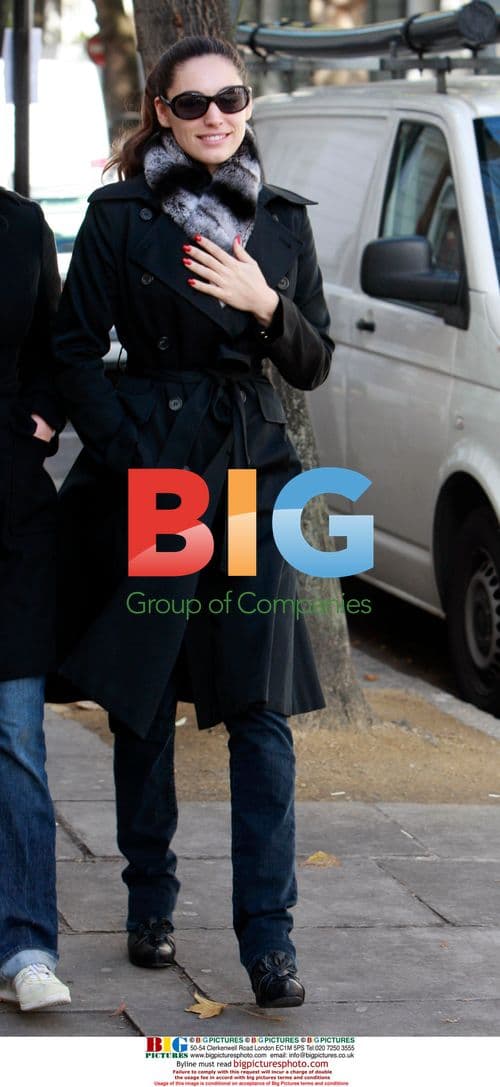 Kelly Brook walks with friend in London