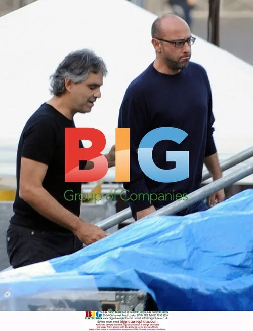 Andrea Bocelli in underwear on balcony in Italy