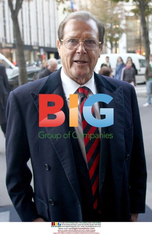 Roger Moore and Wife Return to Hotel in Paris