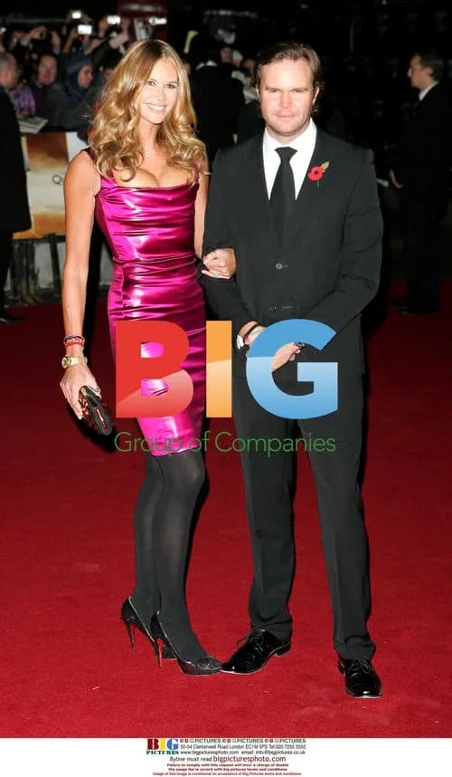 Elle Macpherson spilling out of dress at Bond premiere