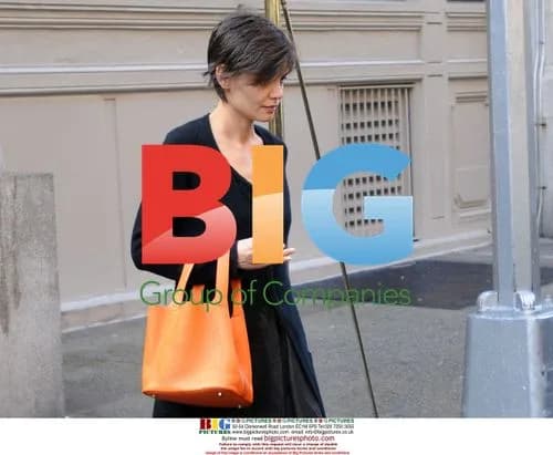 Katie Holmes Leaves Apartment with Orange Purse
