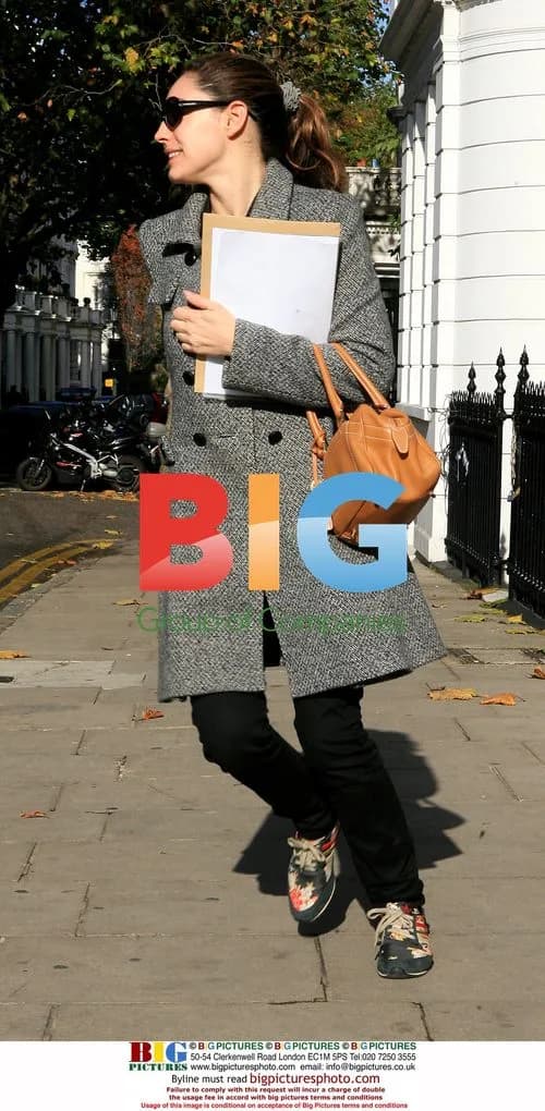 Kelly Brook leaves house in colorful trainers