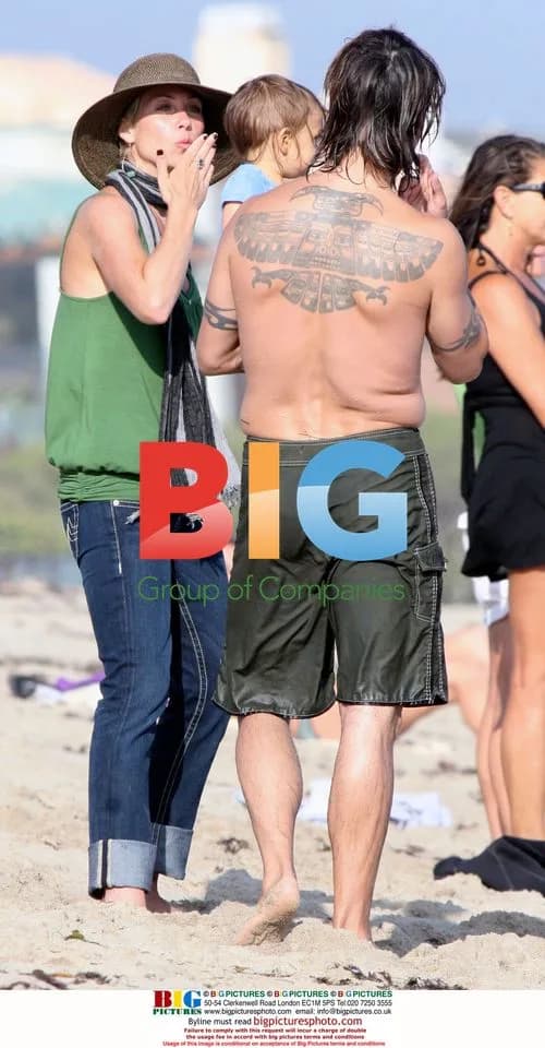 Anthony Kiedis and family surfing in Malibu