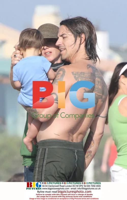 Anthony Kiedis surfing with family in Malibu