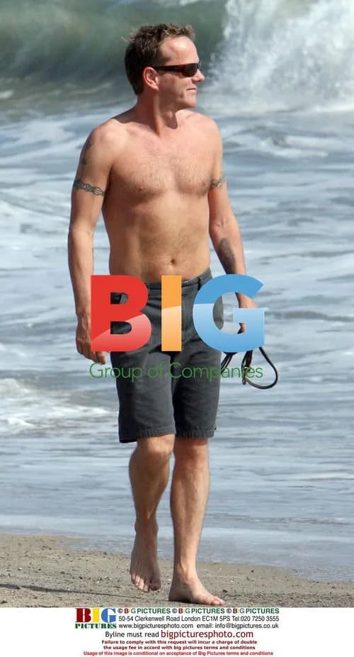 Keifer Sutherland walks dog on Malibu beach