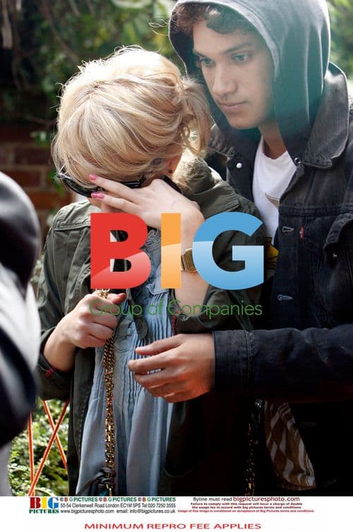 Ronnie Wood arrives home with girlfriend