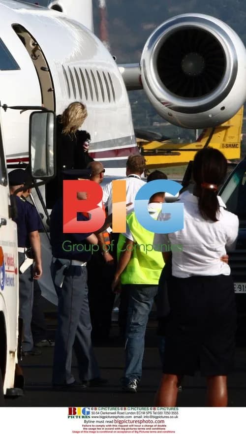 Madonna exits private plane in Rome