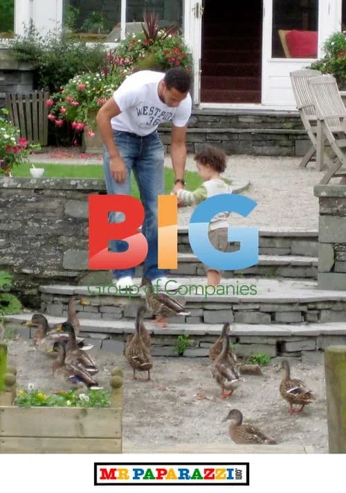 Rio Ferdinand and son by Lake Windermere