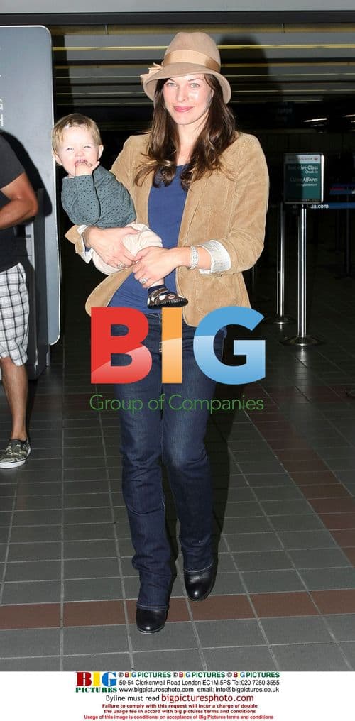 Milla Jovovich and baby depart LAX