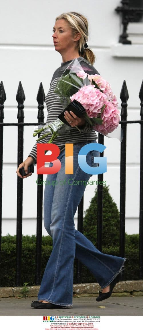 Tamara Beckworth chats on phone with flowers