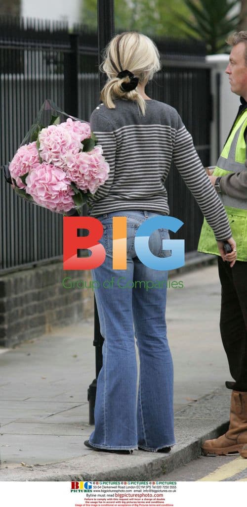 Tamara Beckworth carrying flowers in London