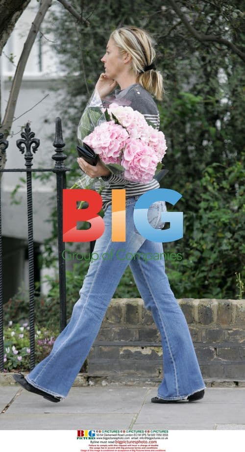 Tamara Beckworth Chatting on Phone with Flowers