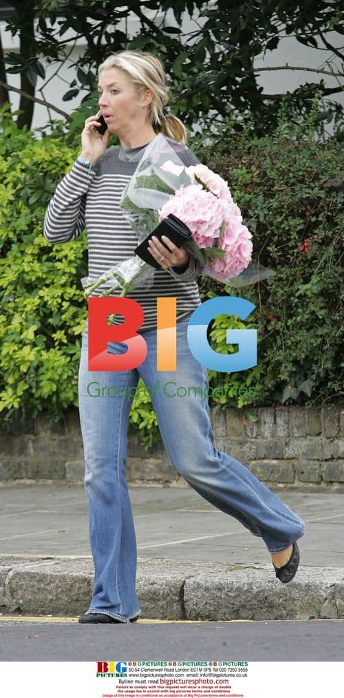 Tamara Beckworth carrying flowers in London