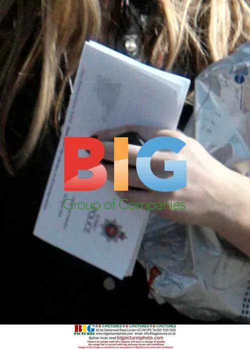 Abigail Clancy Seen with Police Letter