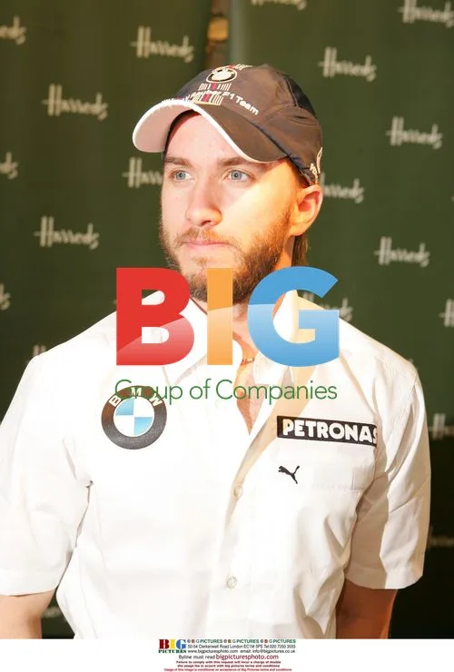 Racing driver Nick Heidfeld signs at Harrods