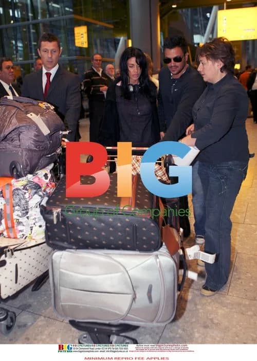Jordan and Peter Andre Arrive at Heathrow