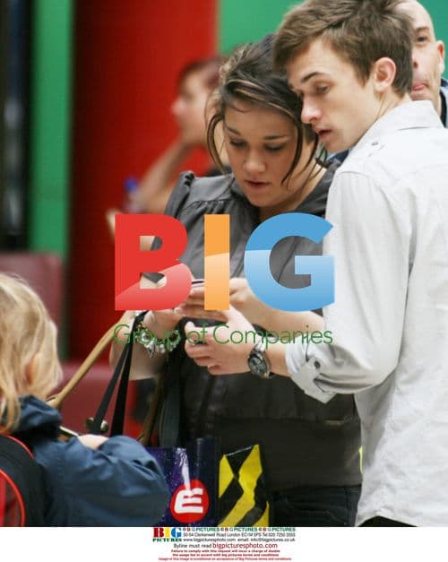 Luke Marsden and Rebecca Shiner signing autographs