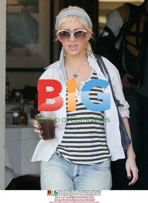 Christina Aguilera shops with assistant in WeHo