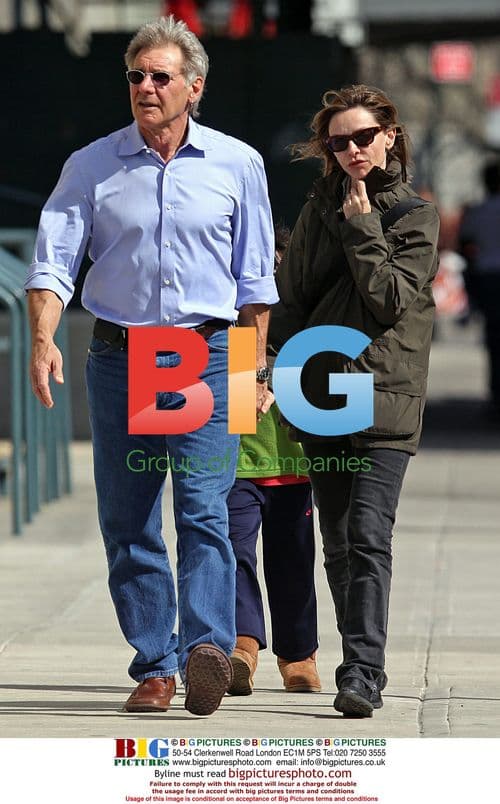 Harrison Ford and Calista Flockhart walk with son