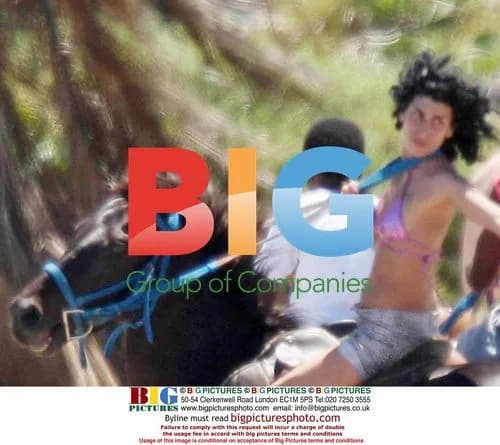 Amy Winehouse rides horse, walks with mystery man