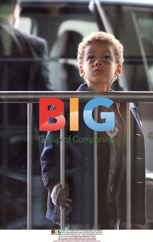 Nicole Coste and son Alexandre leaving Paris