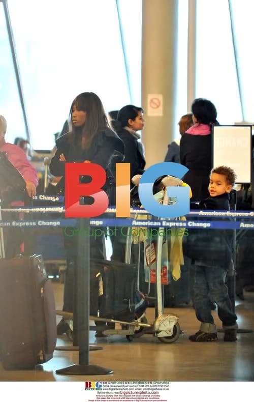Nicole Coste and son Alexandre leaving Paris