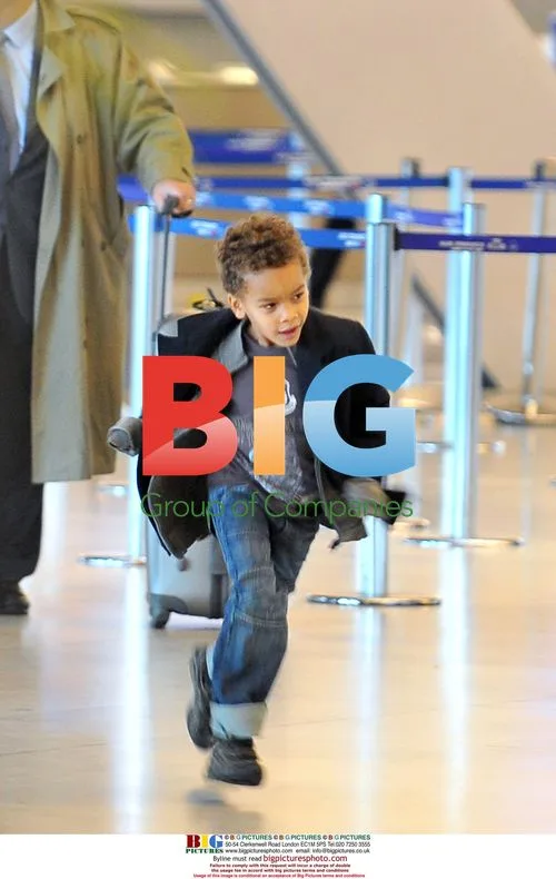 Nicole Coste and son Alexandre leave Paris hotel