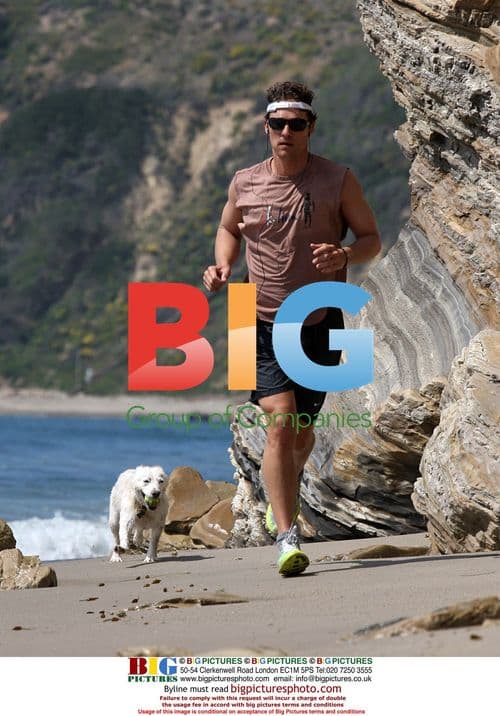 Matthew McConaughey and dog on beach