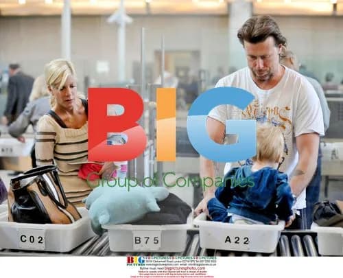 Tori Spelling & Dean McDermott with kids at LAX
