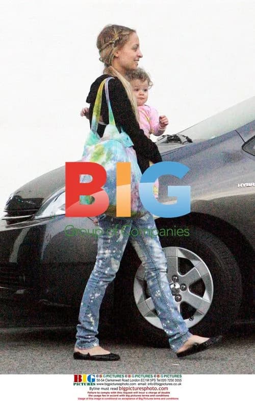 Joel Madden and Nicole Richie with baby