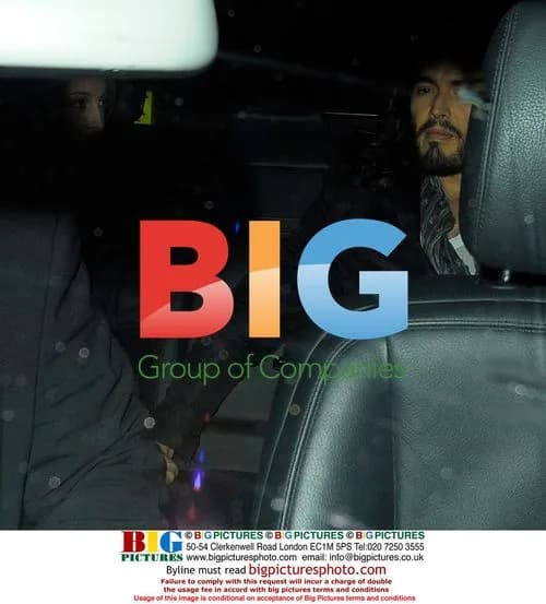 Russell Brand leaves Claridge's with mystery woman