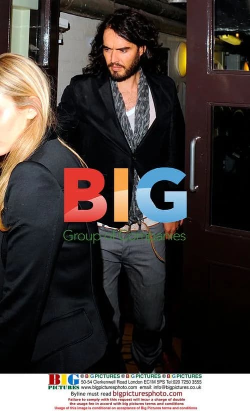 Russell Brand leaves Claridge's with mystery blonde