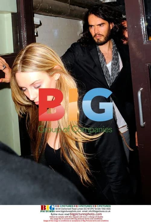 Russell Brand leaves Claridge's with mystery blonde