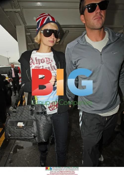 Paris Hilton and Doug Reinhardt at Heathrow