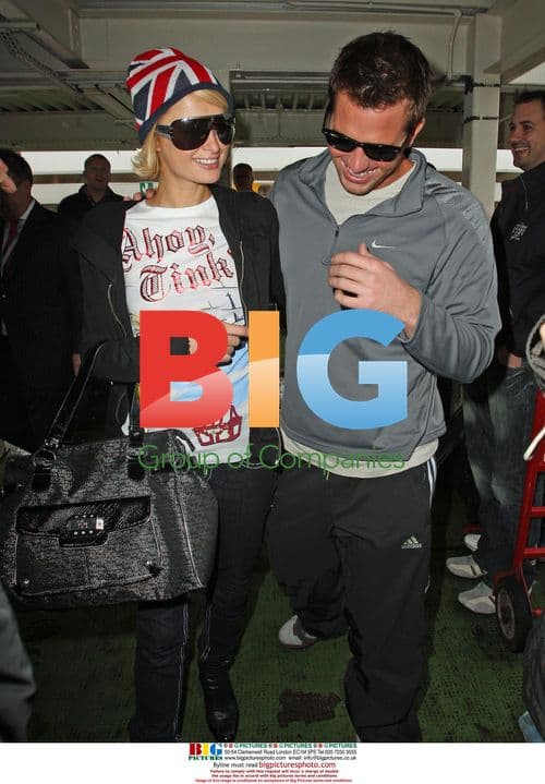 Paris Hilton and boyfriend at Heathrow
