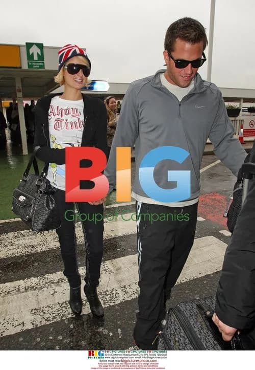 Paris Hilton and Doug Reinhardt at Heathrow
