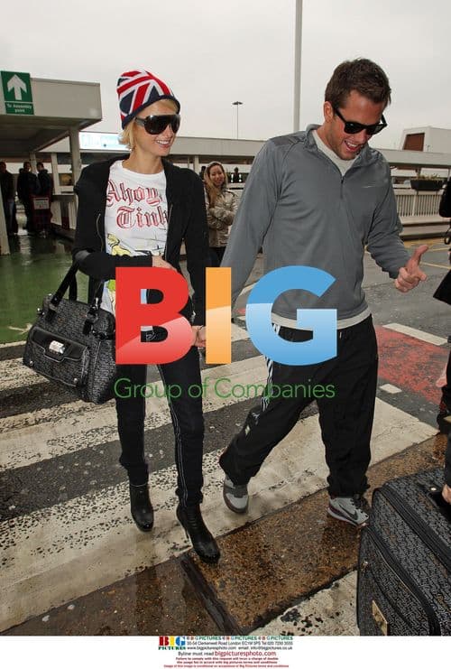 Paris Hilton and Doug Reinhardt Arrive at Heathrow