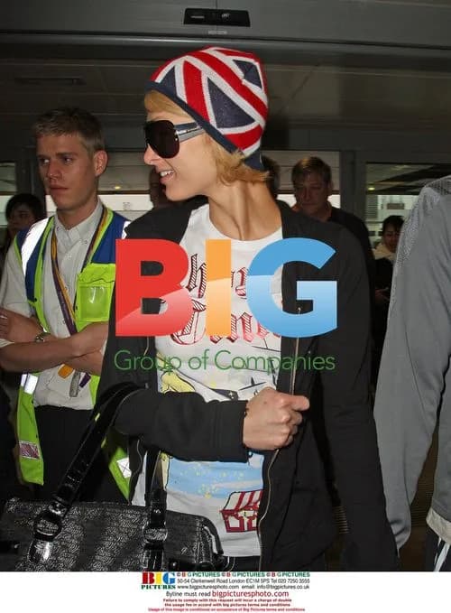 Paris Hilton and boyfriend at Heathrow