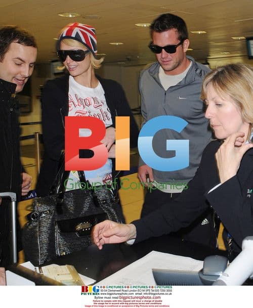 Paris Hilton and boyfriend Doug Reinhardt at Heathrow